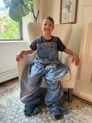 Sam Dagley in Pa's overalls in his Brooklyn apartment