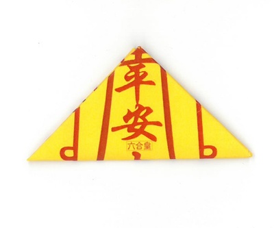 Yellow triangle with red symbols. 
