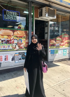 Amirah in front of her dad´s store