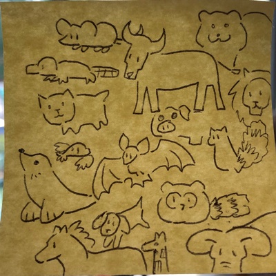 Drawings of mammals on a sticky note.