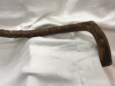 This is the handle of the wooden cane.