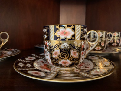 Teacup and saucer with ornate pattern