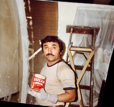 My grandpa painting his house.