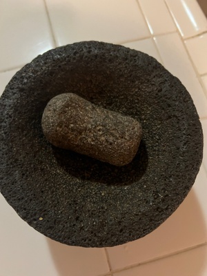 The Molcajete and stone used to grind the food